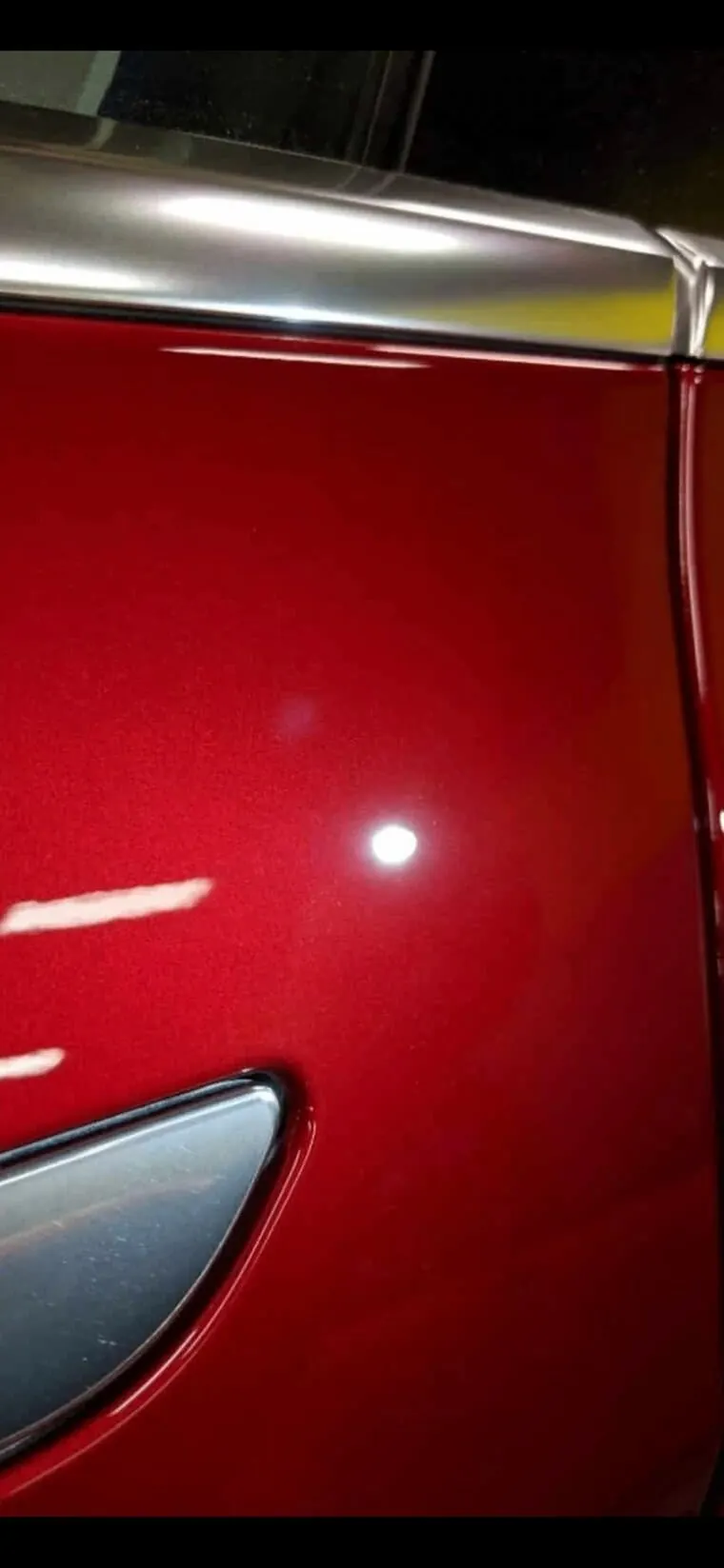 Glossy red door after correction and ceramic coating