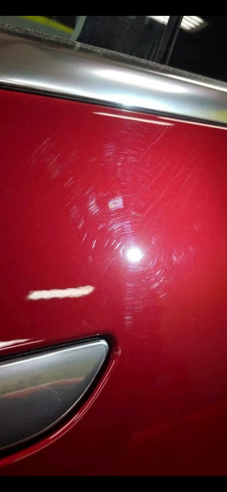 Red door before, covered in swirl marks