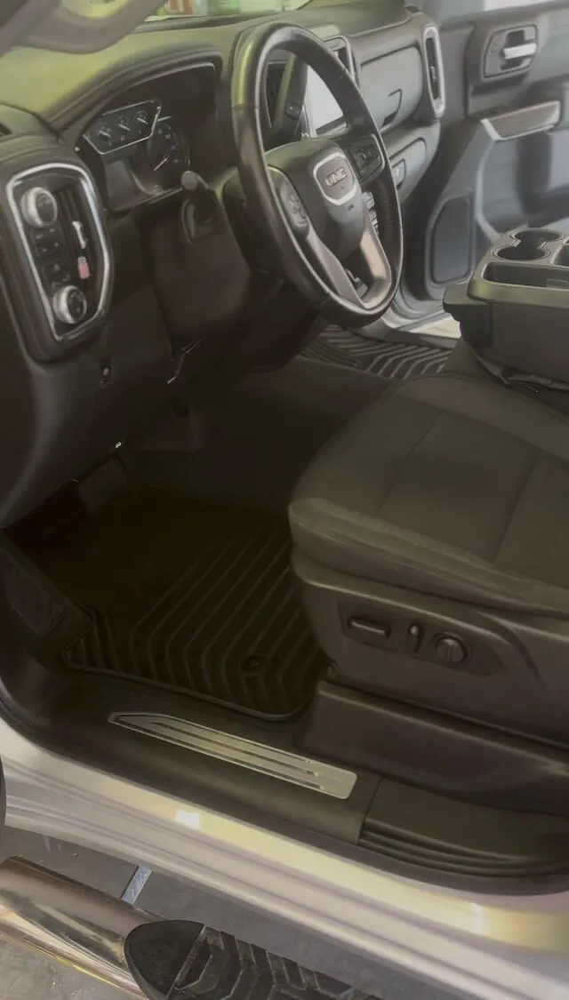 GMC cabin after: clean mats and console